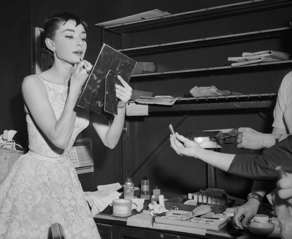 25 Mar 1954 --- Original caption: Audrey Hepburn, Dutch born darling of American film, won a coveted Oscar for the Best Performance by an Actress. The lovely 22 year old actress hit the jackpot with her first American film, Roman Holiday. Here, she is shown in the dressing room of the Center Theater, where she changed after coming from the 46th Street Theater, where she was appearing in Ondine. --- Image by © Bettmann/CORBIS